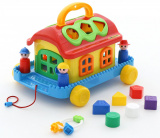 Игрушка-сортер Сказочный домик на колёсиках (в сетке)